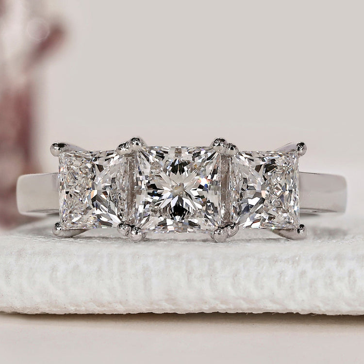 Princess cut three stone diamond engagement ring.