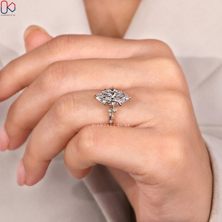 Lab grown marquise ring with round side diamonds.