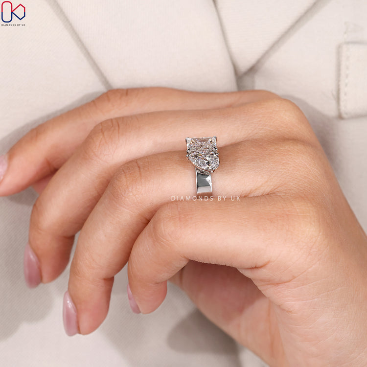Lab grown radiant and pear diamond ring.
