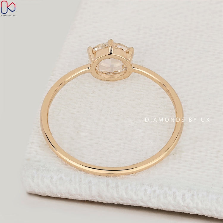 Round rose cut solitaire ring with six prongs.