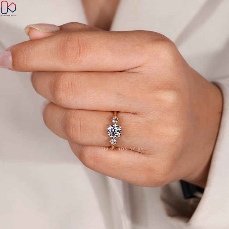 Round cut ring with prong setting and hidden halo.
