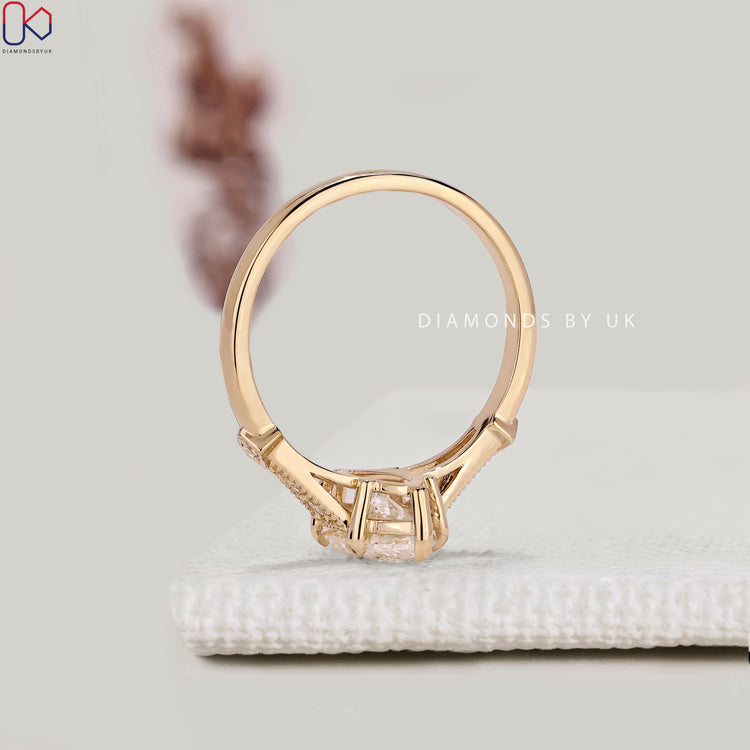 Handmade marquise engagement ring with split shank design.
