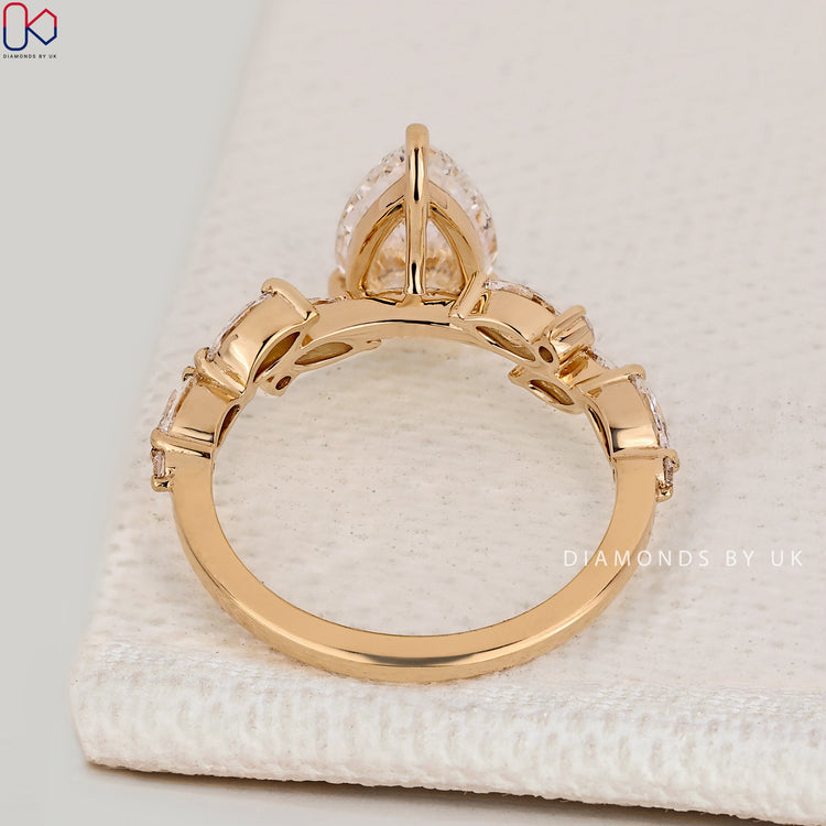 Handmade pear cut ring with three claw prong setting.
