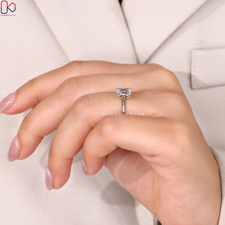 Lab grown criss cut solitaire ring with tab prongs.
