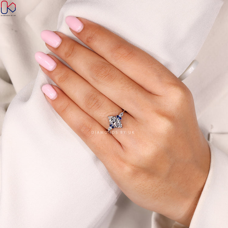 Muse setting marquise ring with six claw prongs.