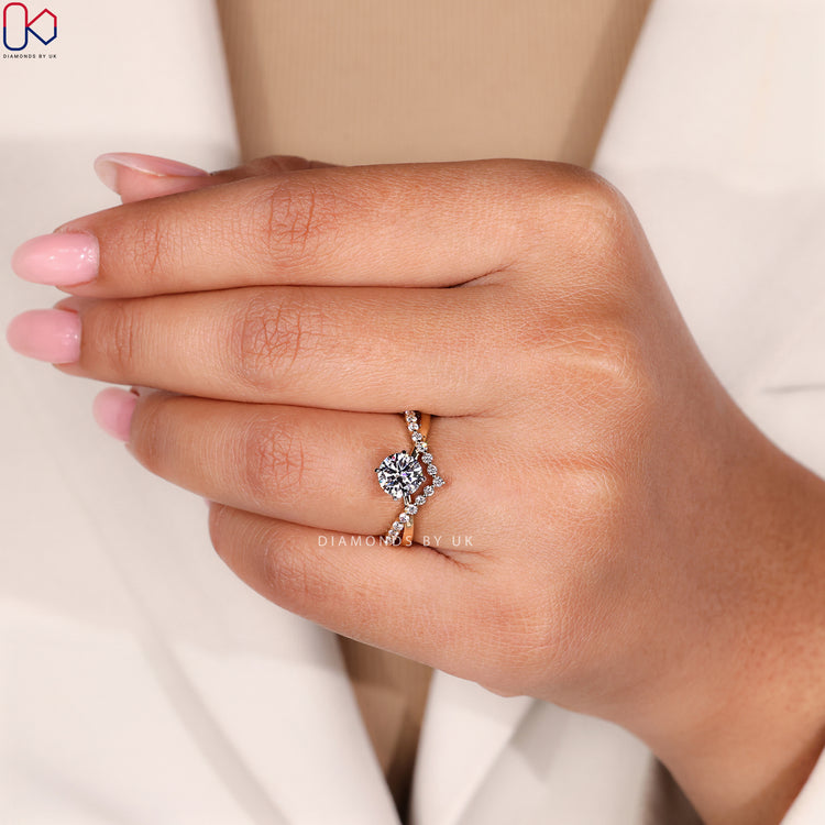 Lab grown round cut ring with V shape setting.