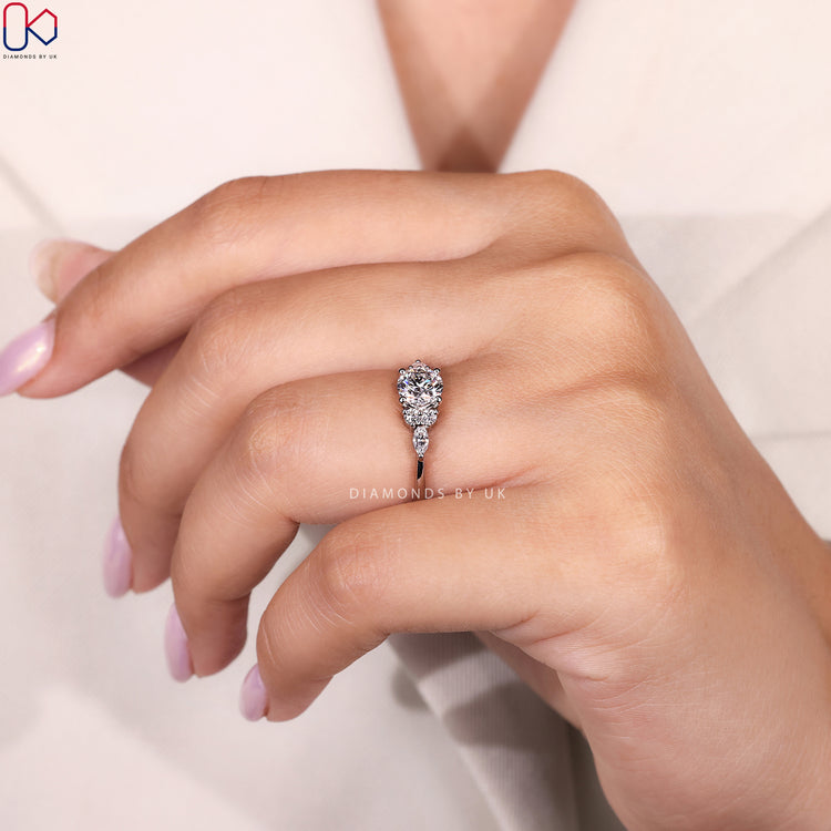 Round cut diamond ring with tapered shank band.