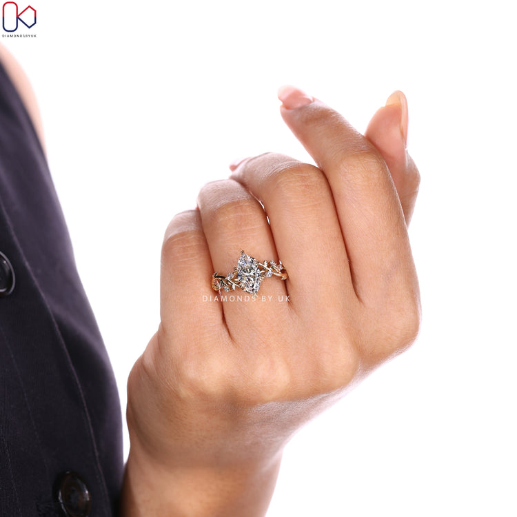 Marquise diamond ring with nature inspired leaf details.
