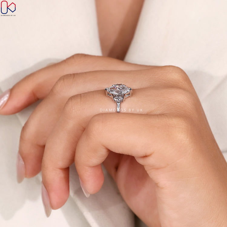 Lab grown marquise ring with side stone accents.
