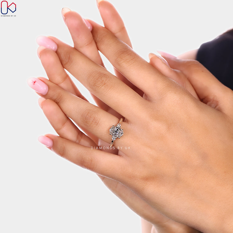 Vintage style oval diamond ring with round side stones
