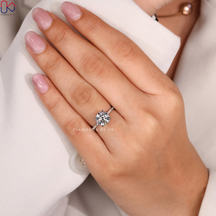 Lab grown round engagement ring with cathedral.