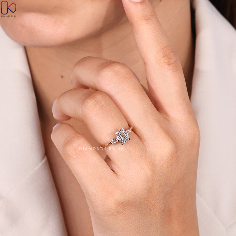 Emerald cut ring with baguette side stone style.