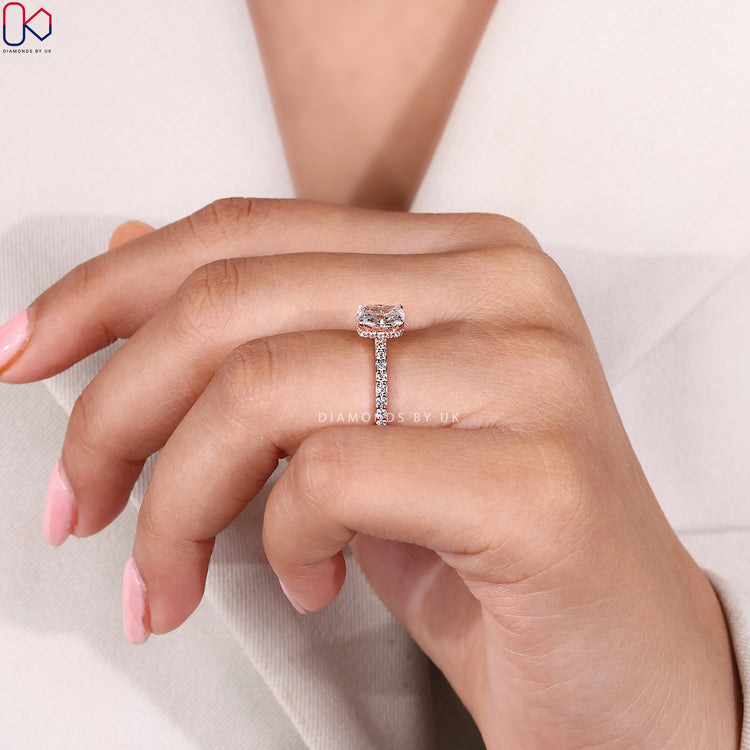 Lab grown cushion cut ring with four claw prongs.