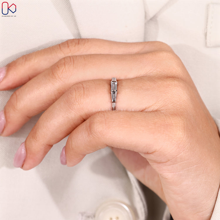 White gold wedding band with 3 stones.
