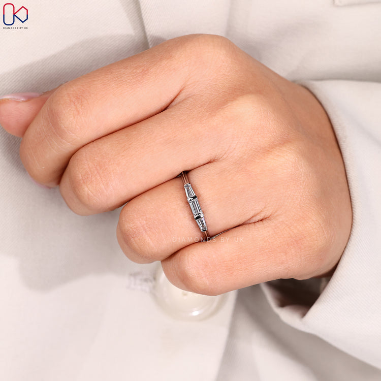 Custom diamond band with baguette cuts.
