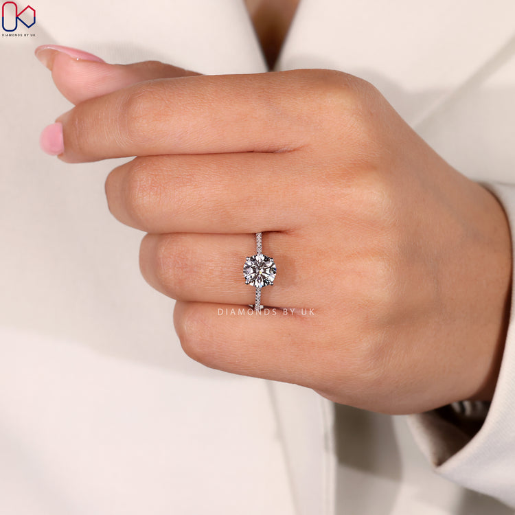 Round cut pave set engagement ring in white gold.
