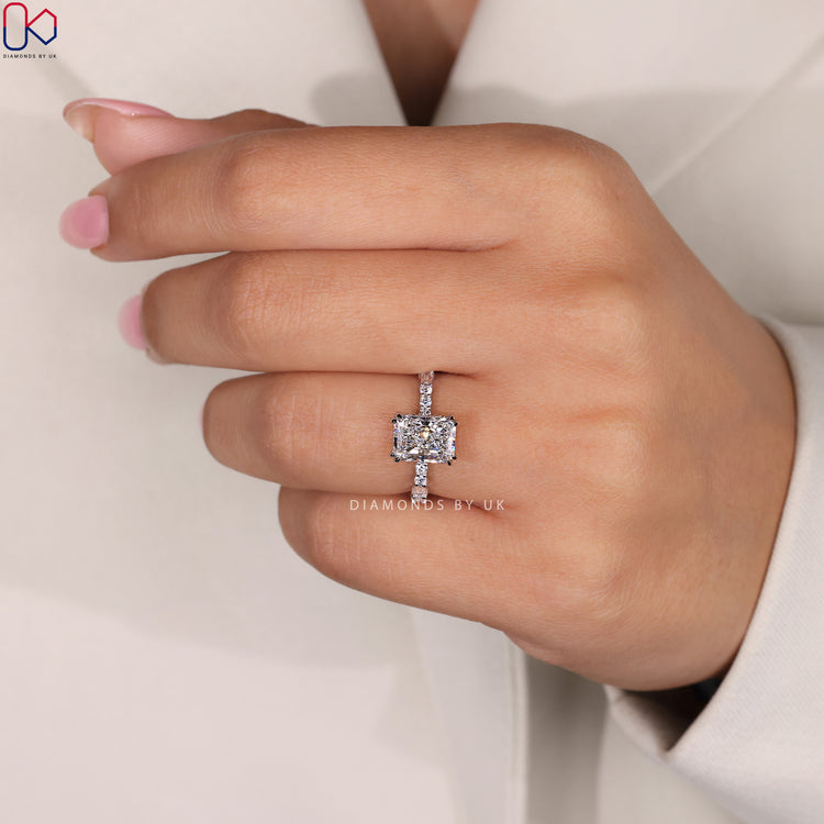 Elegant baguette diamond ring with a radiant cut center.

