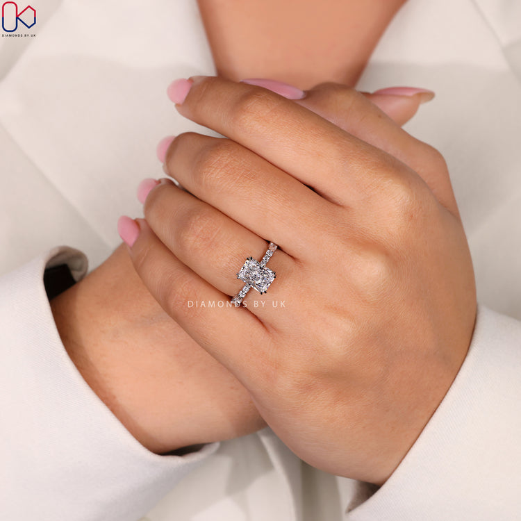 Handmade jewelry featuring a radiant cut diamond in white gold.
