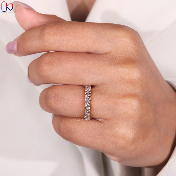 Half eternity diamond band with prong setting.
