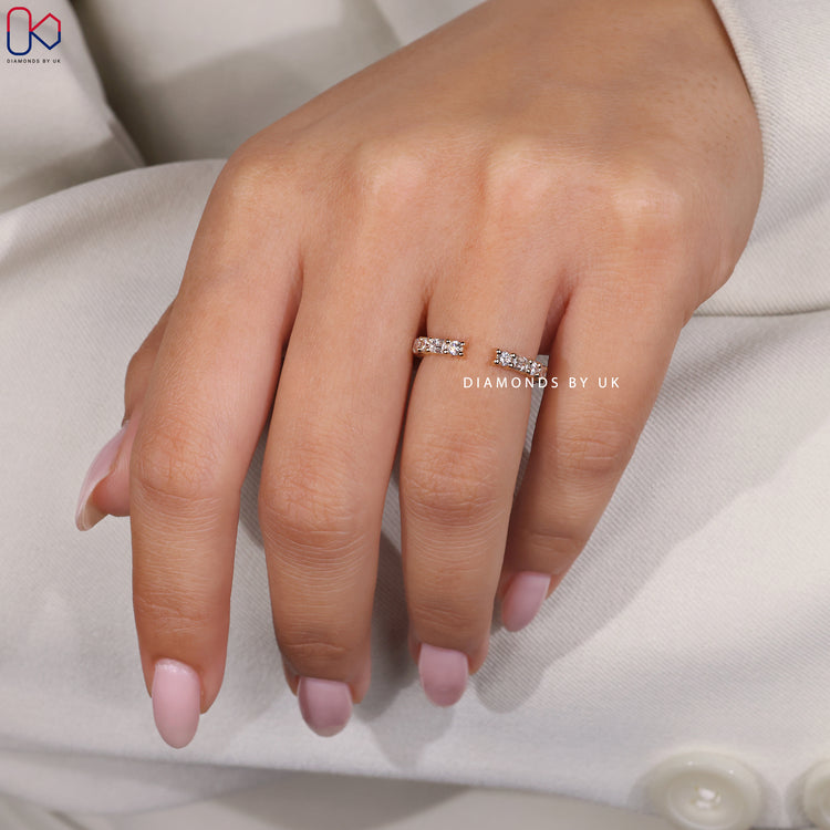 Prong set diamond wedding band in yellow gold.
