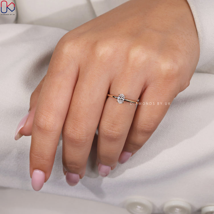 Customize ring with a unique design and oval cut diamond.
