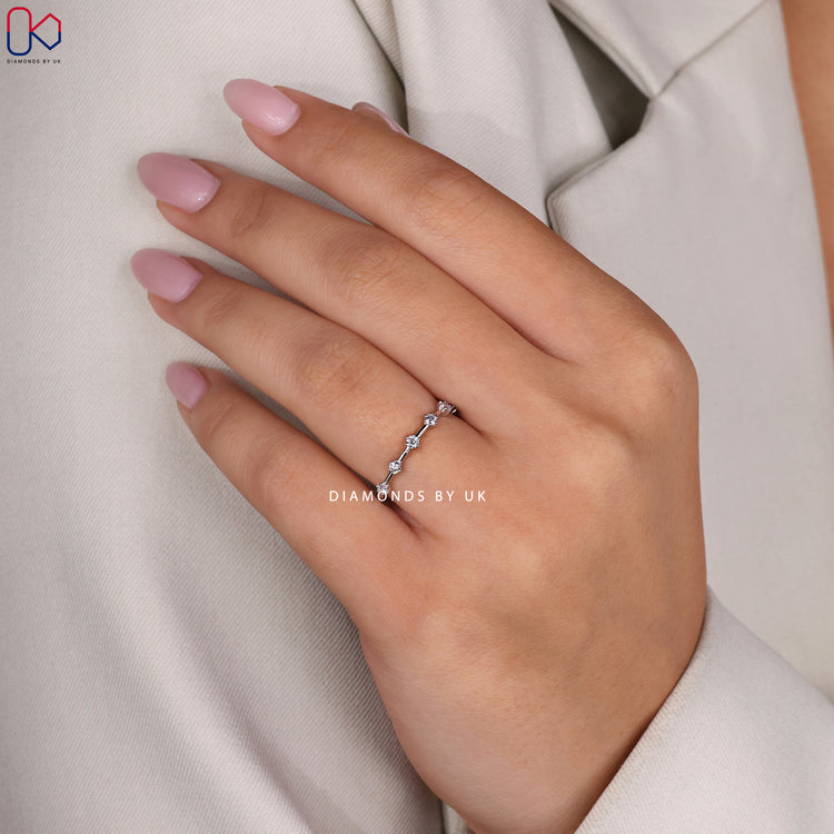 Buy prong set white gold diamond band.
