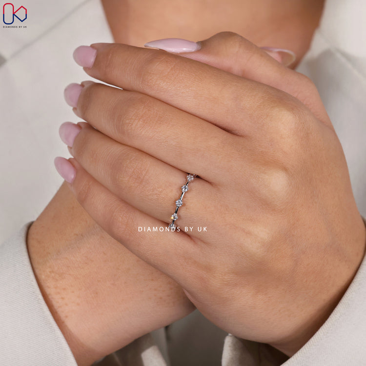 Prong set white gold diamond wedding band.
