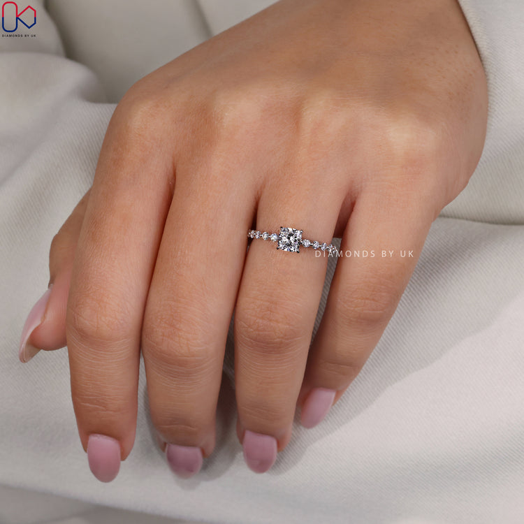 Diamond eternity ring crafted in white gold with lab grown cushion cuts.