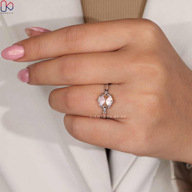 Six prong setting rose cut diamond engagement ring.
