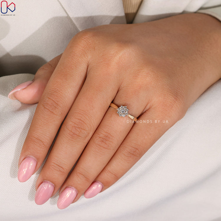 Halo setting engagement ring in yellow gold.
