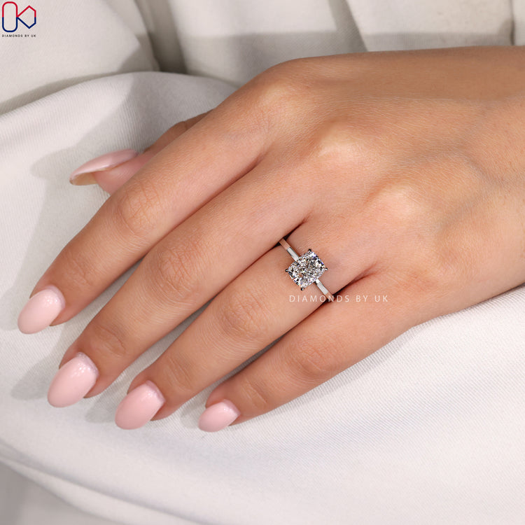 Handmade ring from Diamondsbyuk with a 4 claw setting and cushion cut diamond.