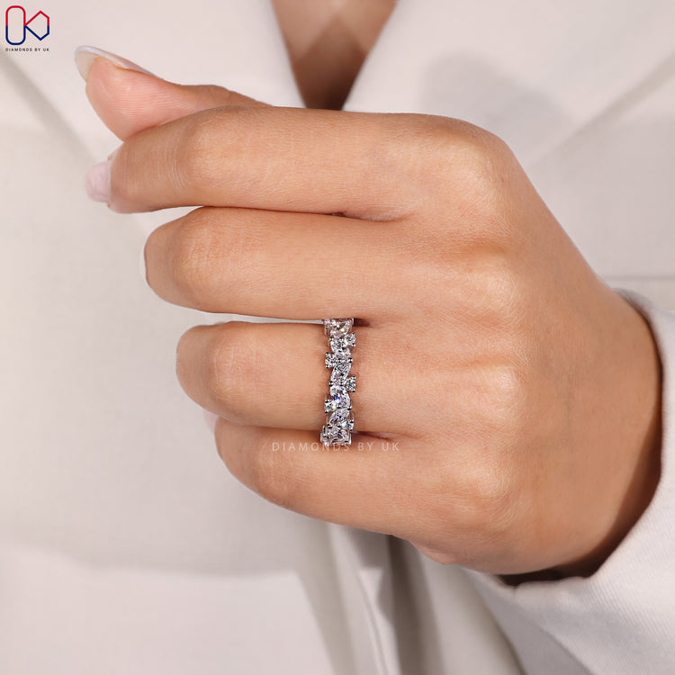 Handmade band with marquise and round diamonds.
