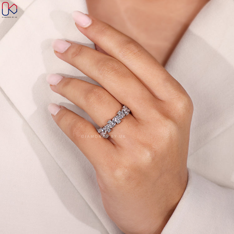 Half eternity marquise and round diamond wedding band.
