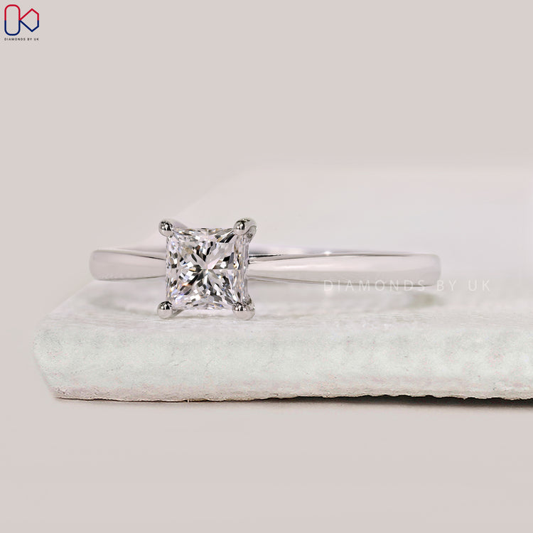 Cathedral setting engagement ring with princess cut diamond.
