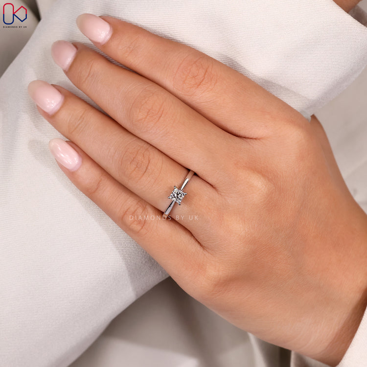 Princess cut solitaire engagement ring in white gold.
