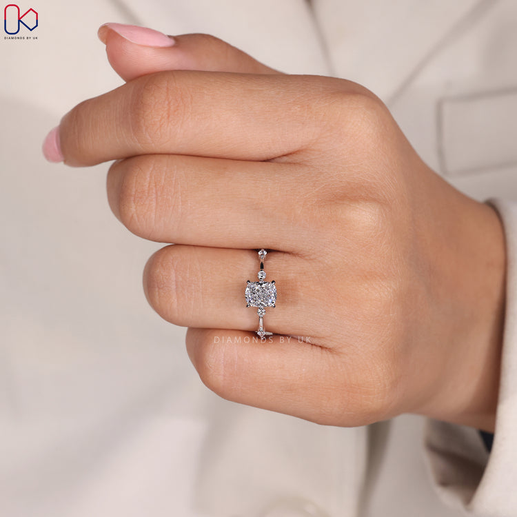 Four claw prong setting cushion cut engagement ring.
