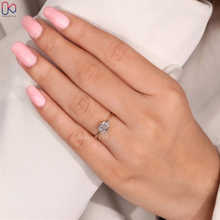 Diamondsbyuk yellow gold radiant cut engagement ring.
