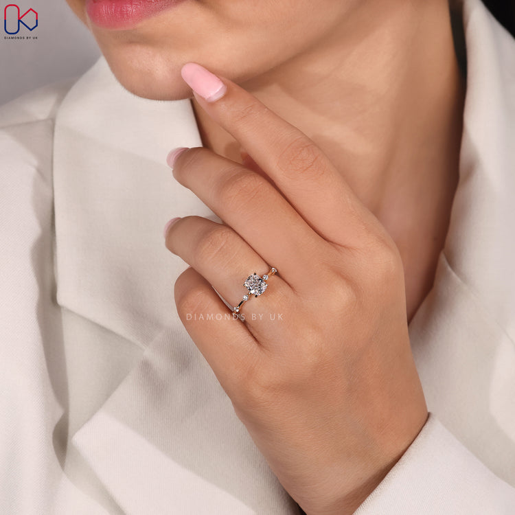 Round cut pave band ring with cushion centre stone.
