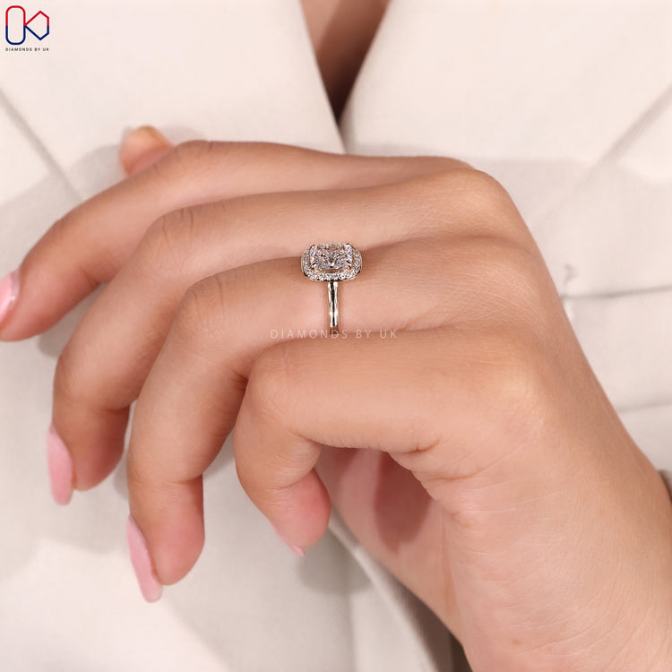 Open gallery diamond engagement ring with halo setting.
