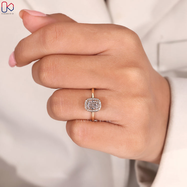 Four prong claw setting hidden halo engagement ring.
