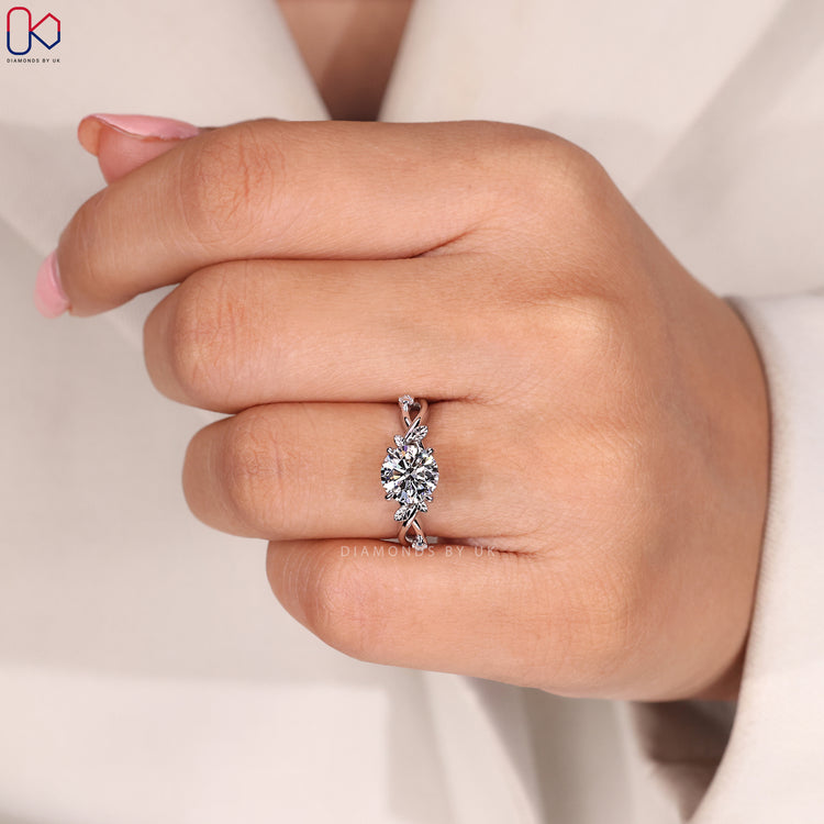 Round diamond engagement ring with nature inspired design.
