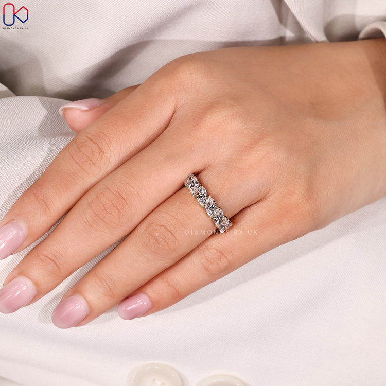 Prong setting wedding band with marquise stones.
