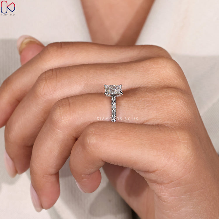 Custom white gold engagement ring with claw prong setting.
