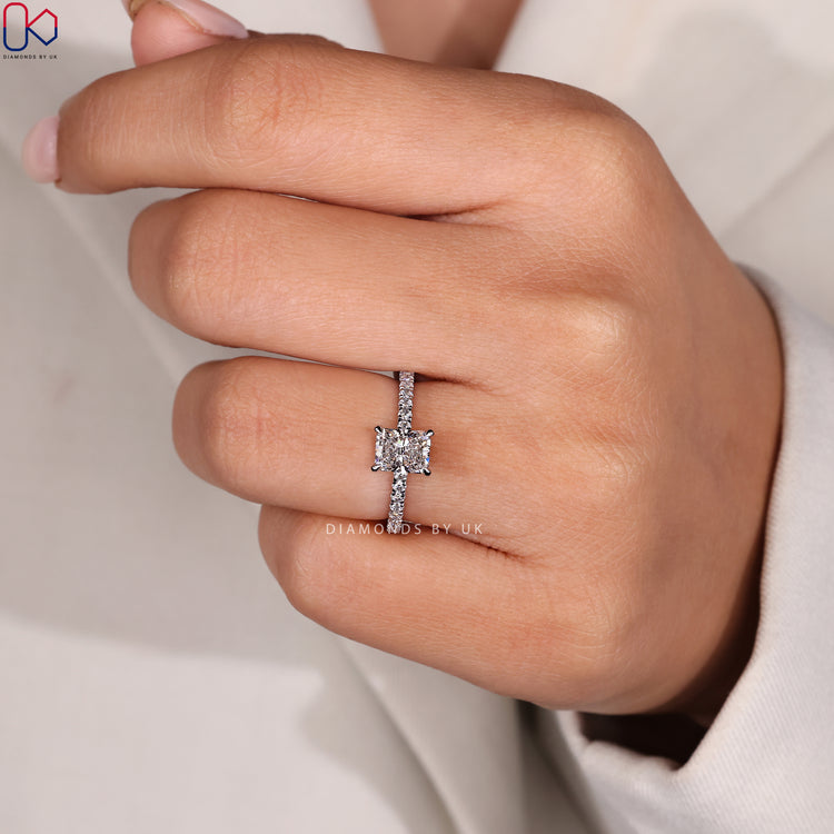 Handmade radiant cut diamond ring with pave band.
