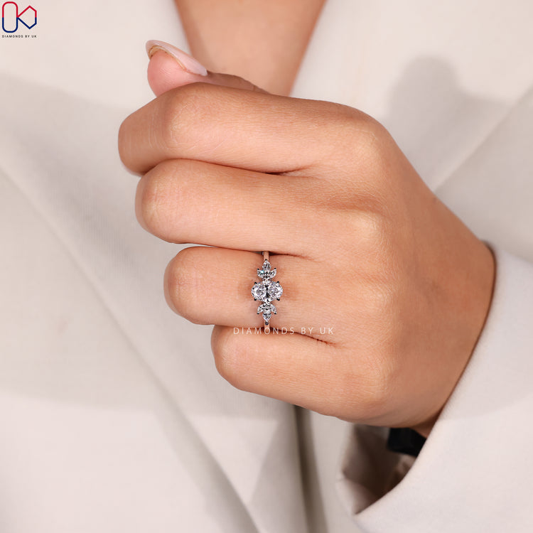 Lab grown diamond ring with marquise and oval stones.
