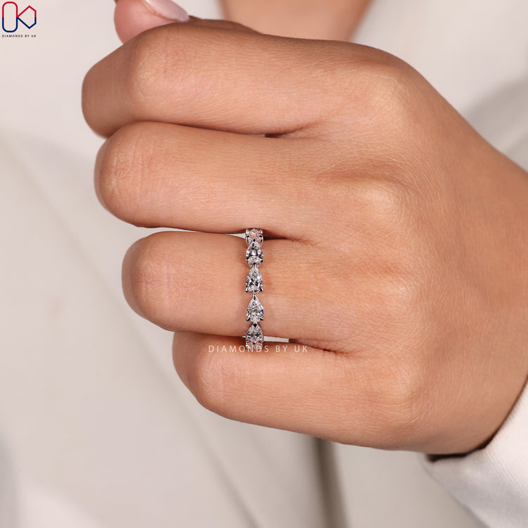 Custom wedding band with pear cut diamonds.
