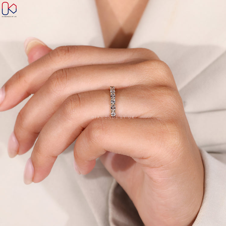 Yellow gold wedding band with diamonds.
