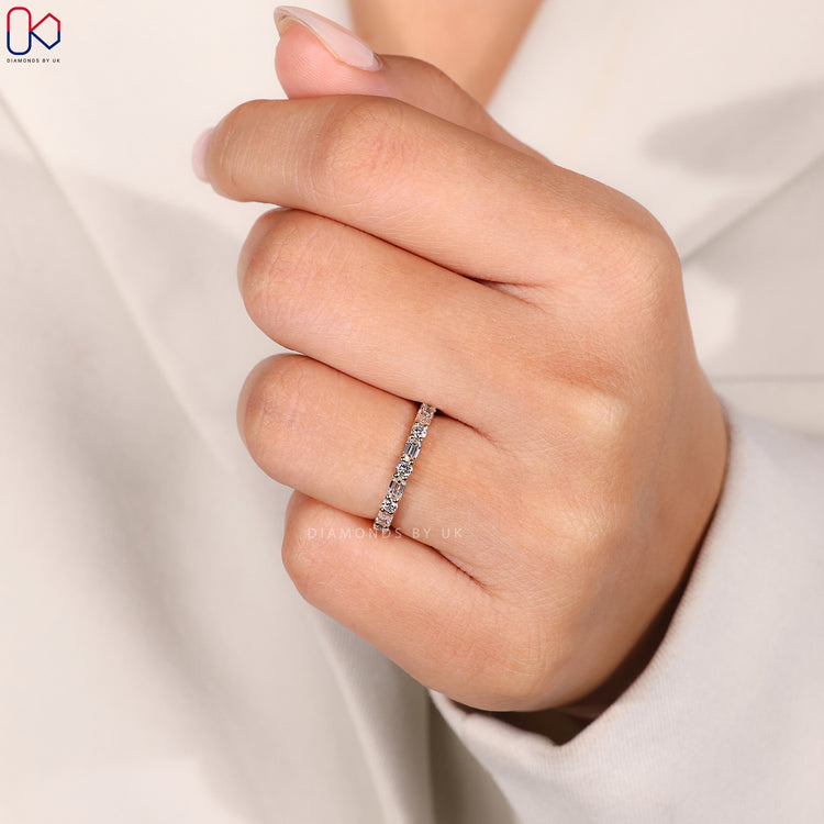 Shared prong wedding band by Diamondsbyuk.
