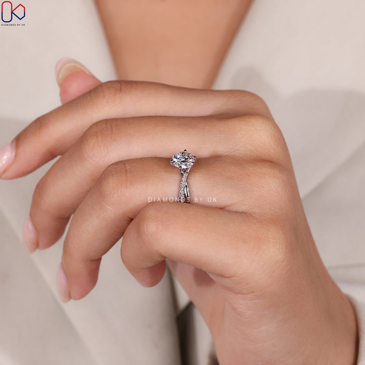 Handmade ring featuring round cut and pave setting.
