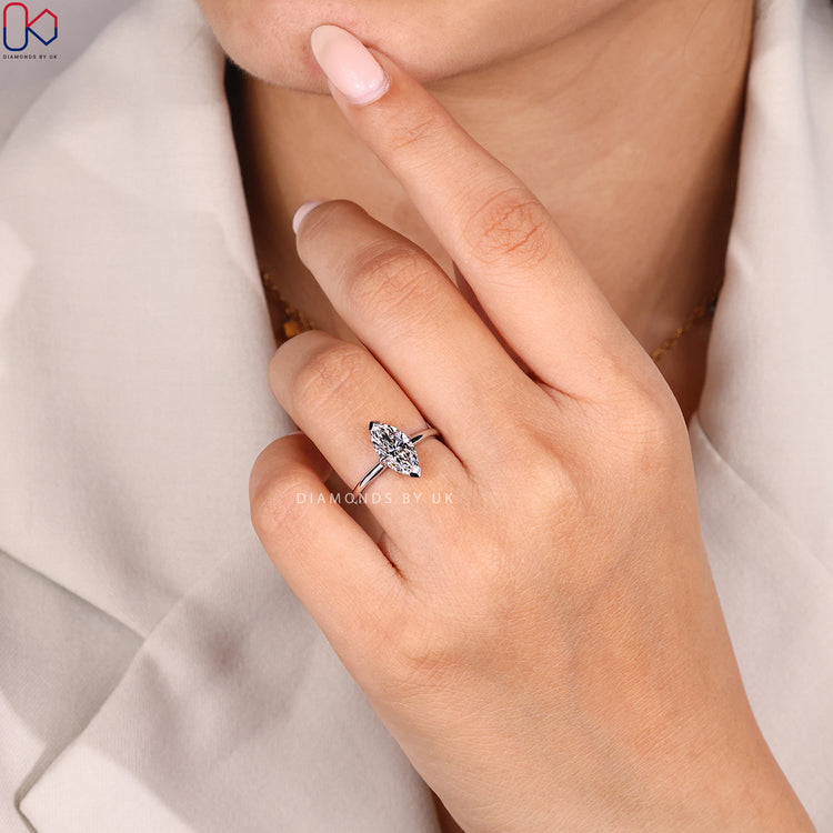 White gold diamond ring with marquise solitaire.
